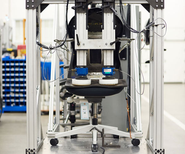 The tilt mechanism of an Onyx black Herman Miller Aeron
